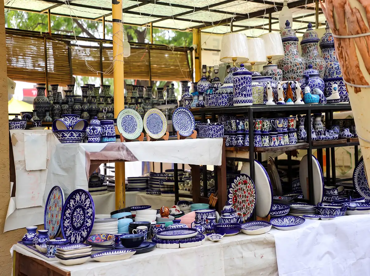 Colourful blue pottery on display at a Hunner Gali stall