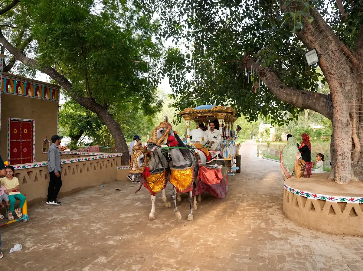 Happy children playing on a merry-go-round ride in kids playground