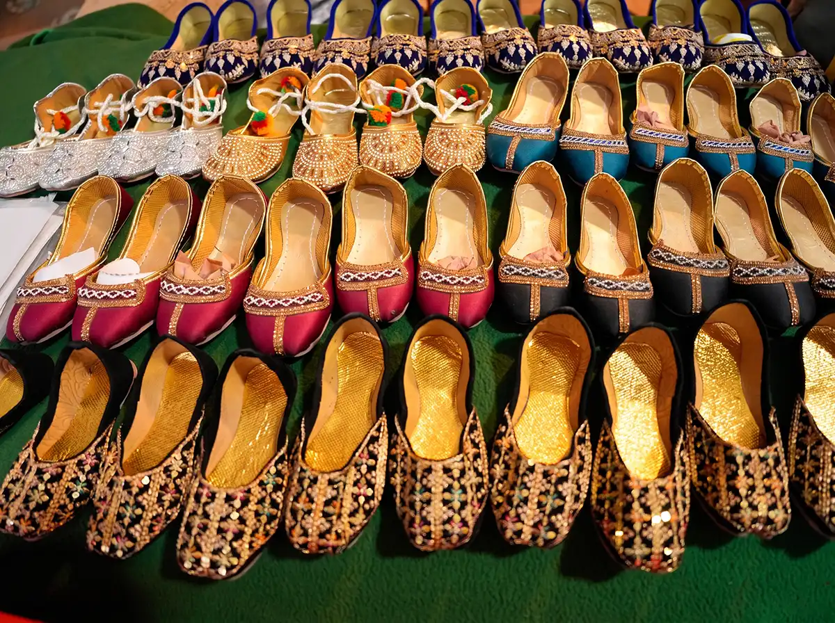 Rows of traditional embroidered khussa shoes for sale