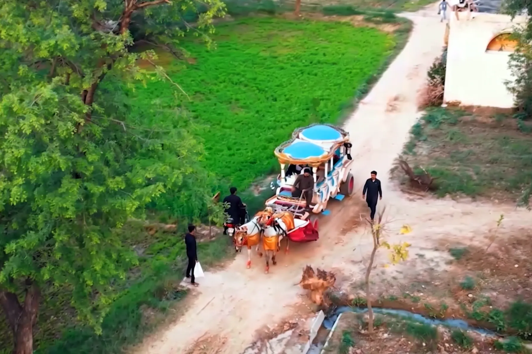 Traditional hand-carved horse swings ride for children in outdoor park