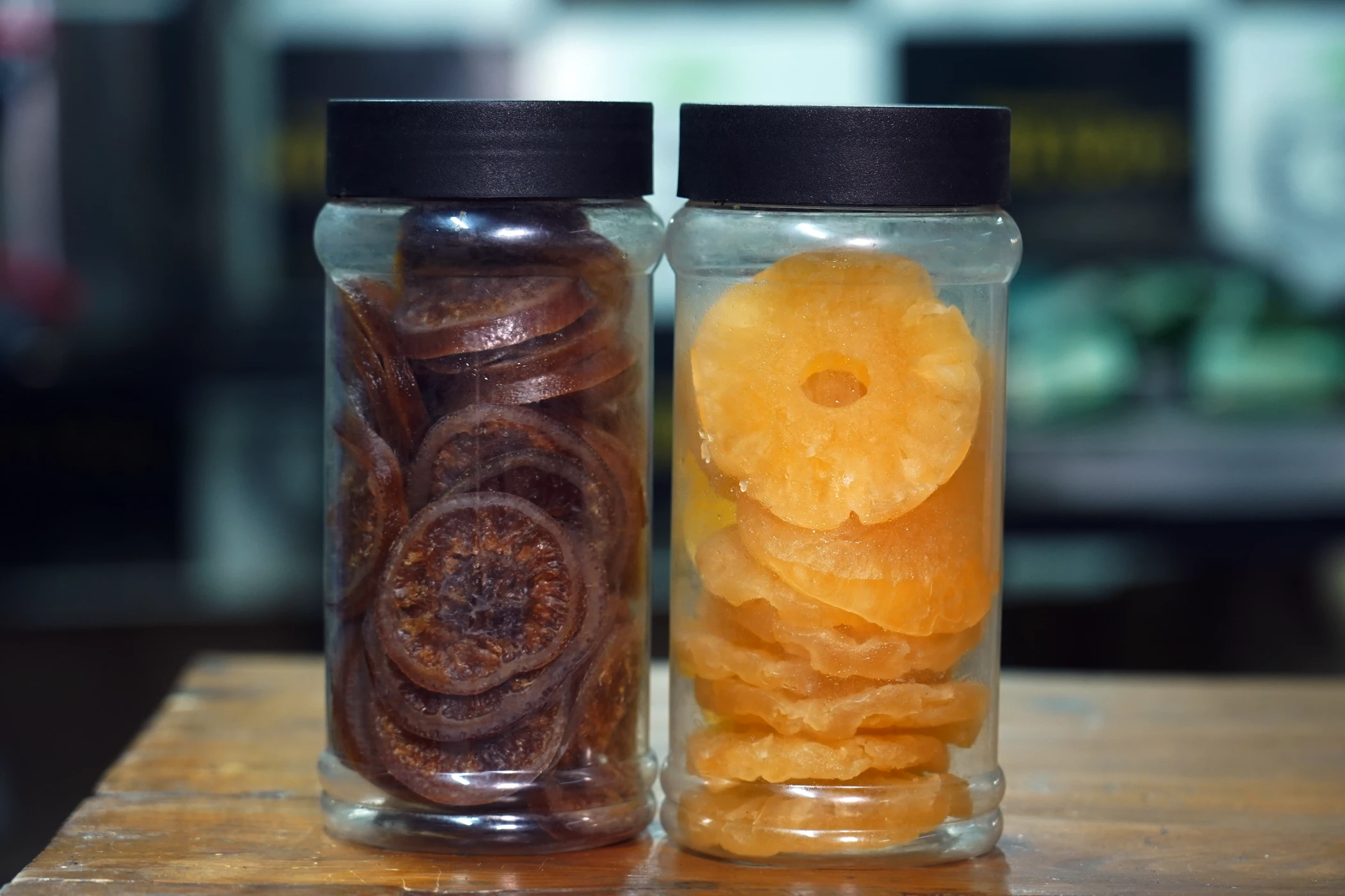 Dehydrated organic dried kiwi and pineapple fruit slices in jars by Organic Aprico at Lahore Organic Village.