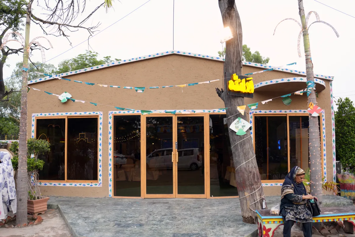 Welcome sign and entrance archway at Event Hall / Veranda, Lahore Organic Village